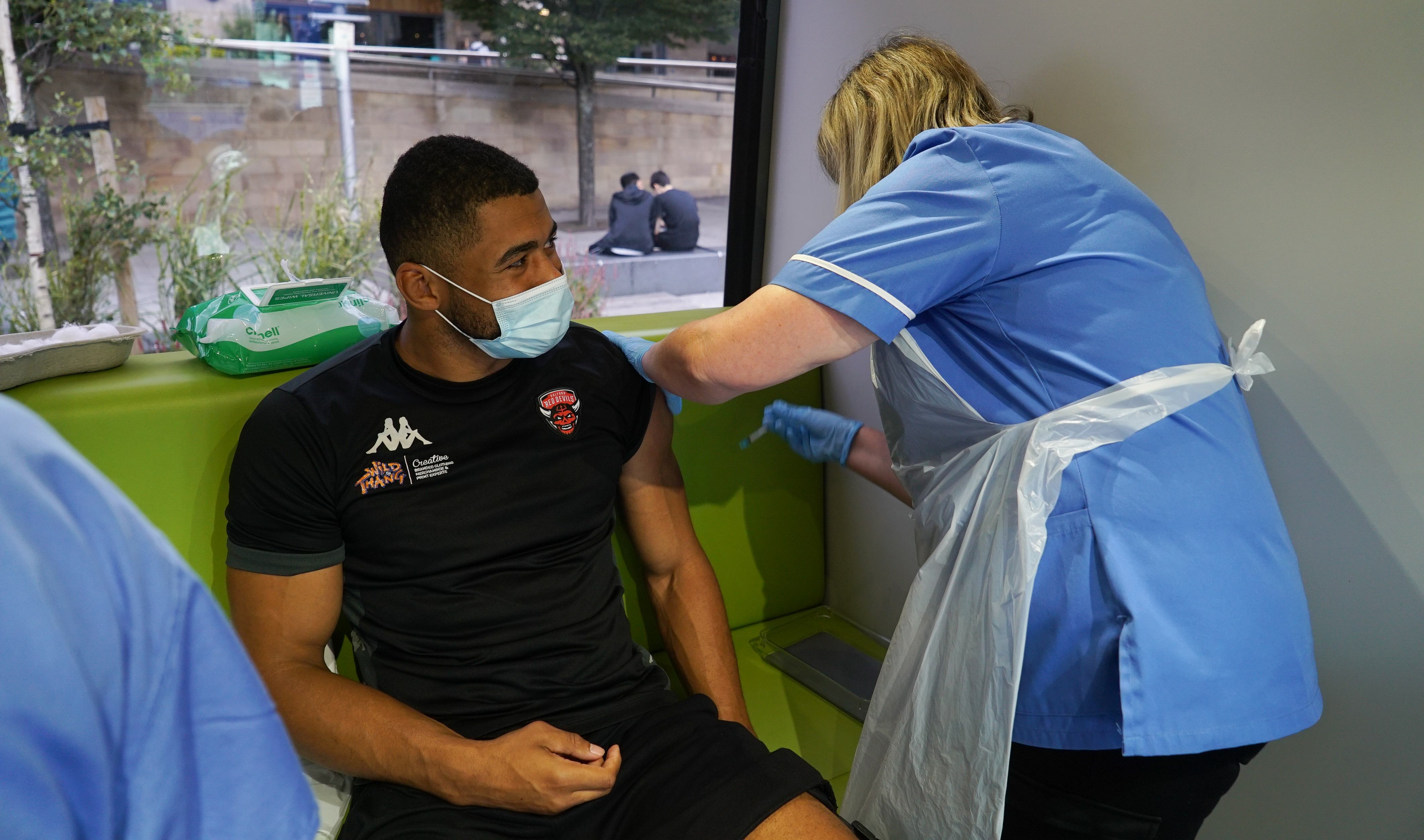 Kallum Watkins getting his vaccine