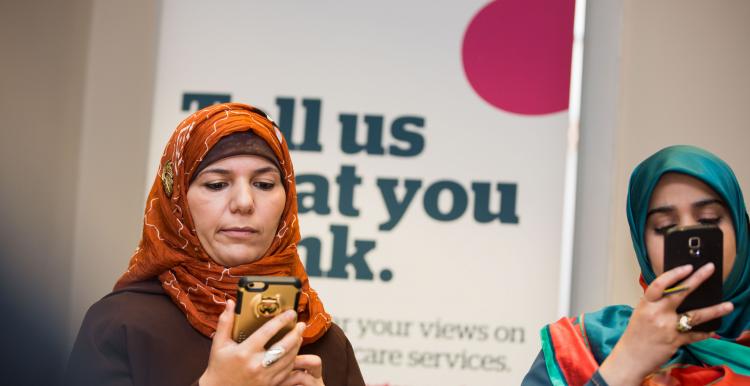 Two women looking at their mobile phones
