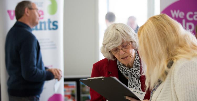 Healthwatch staff member speaking to a member of the public about their experience