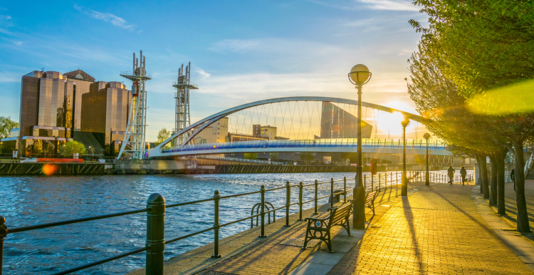 Photo of two people jogging by Salford Quays