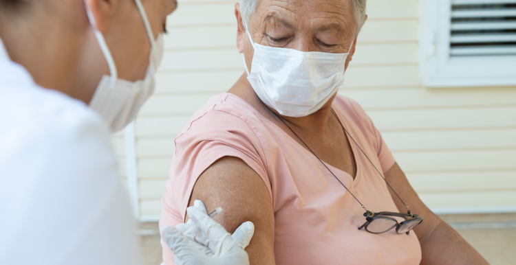 A woman receiving a vaccination