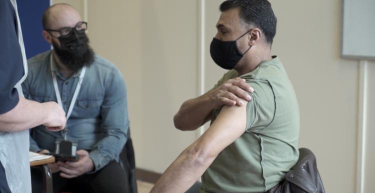 Man receiving vaccine