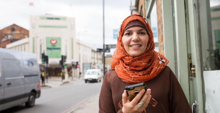 Woman holding her mobile phone