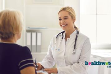 Female doctor speaking to a female patient.