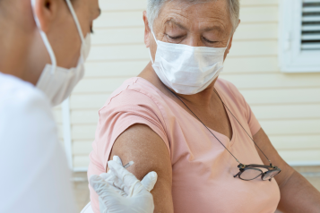 A woman receiving a vaccination