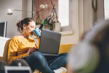 Person sat at home with their laptop