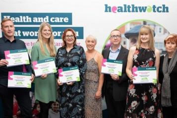 Healthwatch staff from across Greater Manchester holding their award certificates