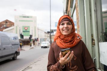 Woman holding her mobile phone